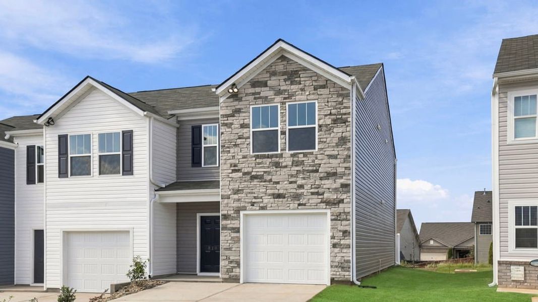 Front exterior of a new home in Tanglewood Townes, Greenville, SC, highlighting curb appeal (Image 2). Front exterior of a new home in Tanglewood Townes, Greenville, SC, highlighting curb appeal (Image 2).