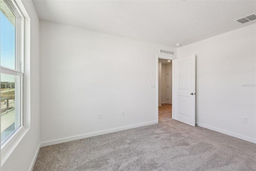 Spacious, unfurnished interior of a new home in Cyrene at Harmony, St. Cloud (Image 24).