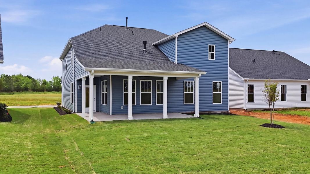 Notable exterior includes a rear covered porch designed for year-round enjoyment