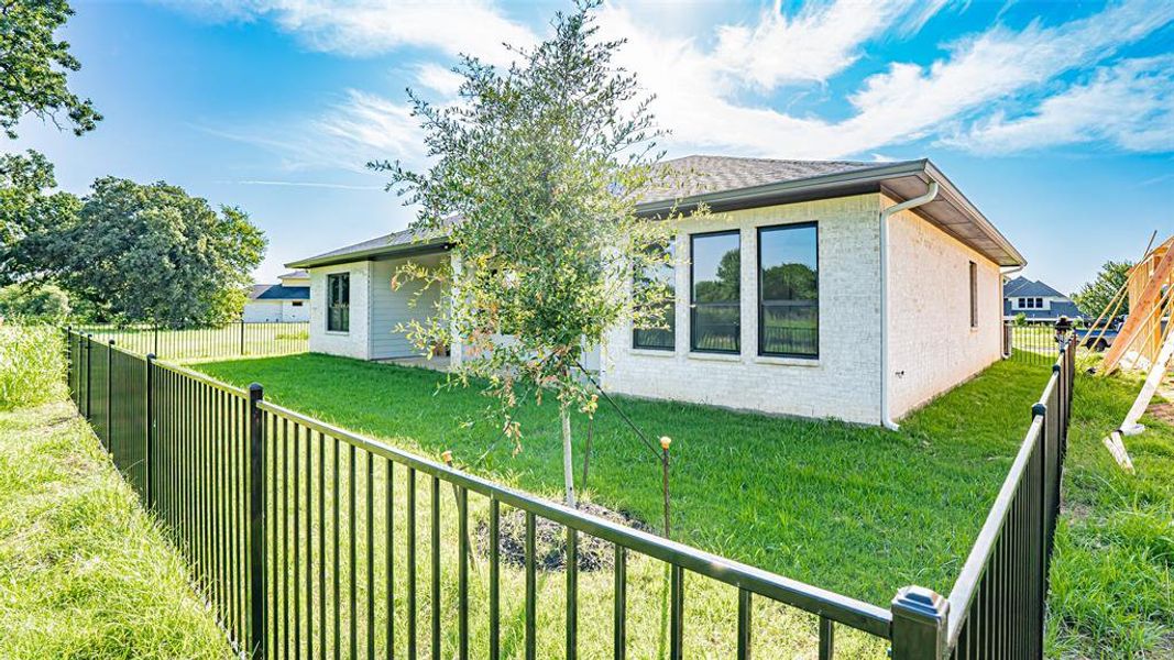 Front exterior of a new home in , Burleson, TX, highlighting curb appeal (Image 1).