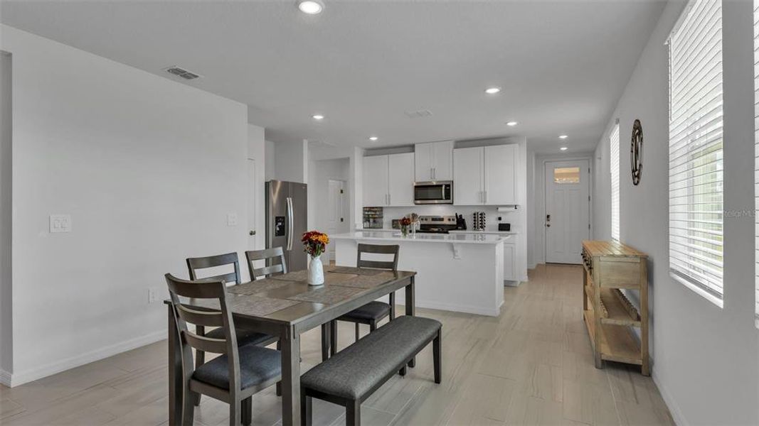 Furnished interior view inside a new home in The Grove at Stuart Crossing - Premier Series, Bartow (Image 29).