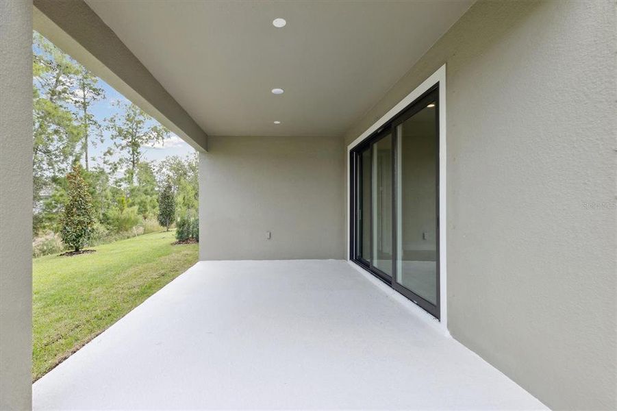 Exterior details and patio area of a home in Caldera, Spring Hill (Image 2).