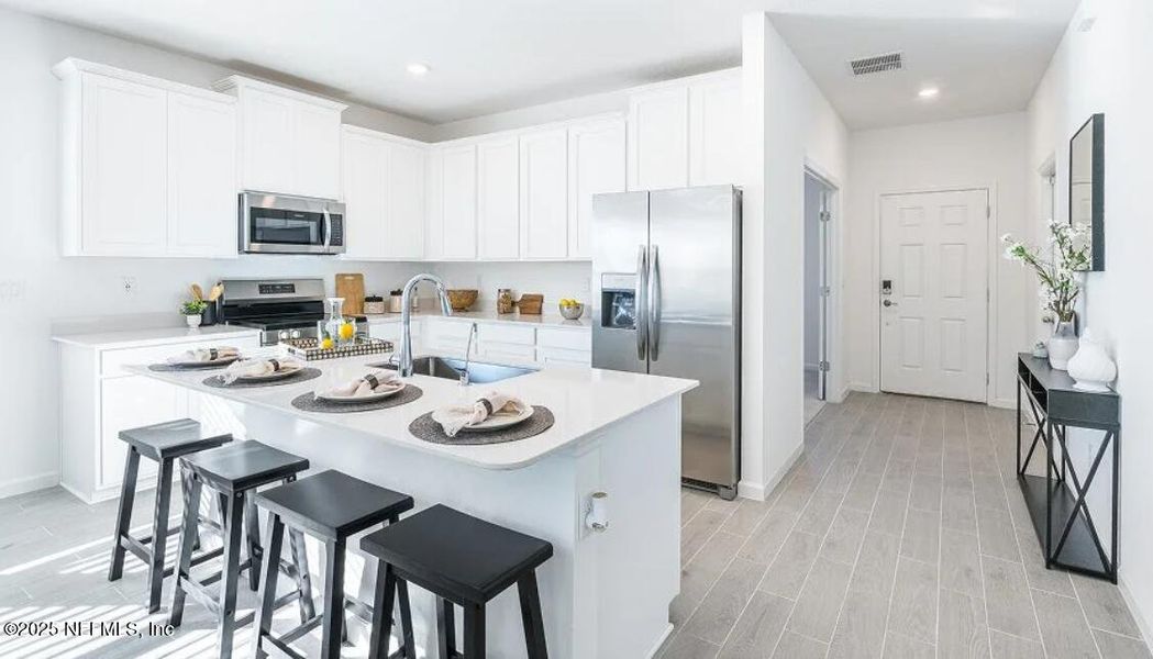 Furnished interior view inside a new home in Edenbrooke at Hyland Trail | 55+: Edenbrooke at Hyland Trail 50s, Green Cove Springs (Image 10).