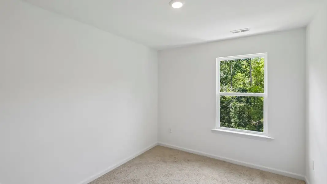 Spacious, unfurnished interior of a new home in The Townes at Belle Grove, Wendell (Image 15).