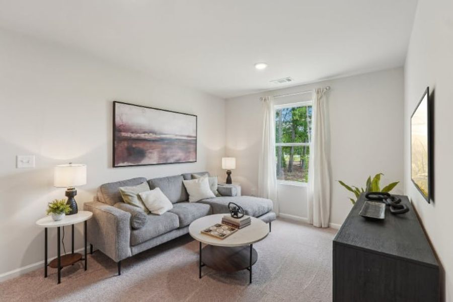 A living room with a couch and a coffee table.