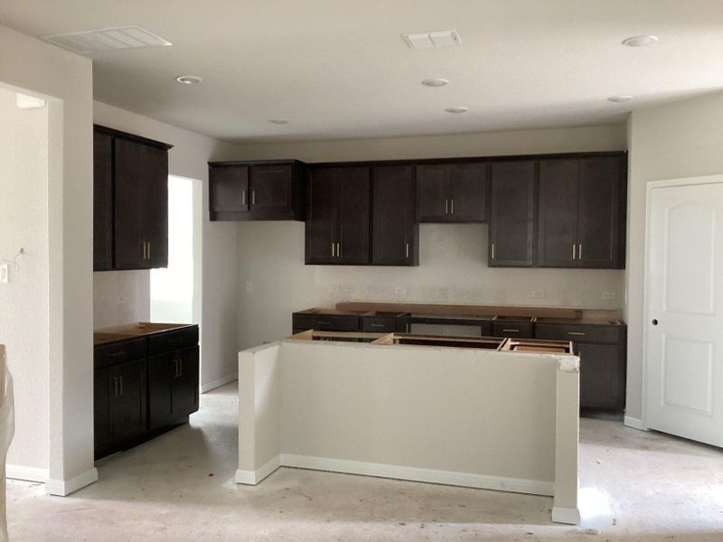 In-progress construction of a new home in The Cottages at Lariat, Liberty Hill, TX (Image 18).