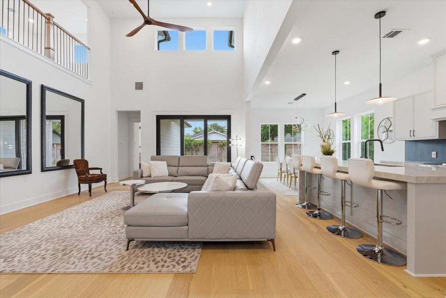 The open-concept layout is ideal for entertaining and everyday living. Soaring 21 foot ceilings!