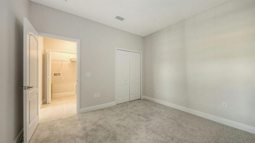 Spacious, unfurnished interior of a new home in Wildleaf Real Estate and Homes for Sale in Parrish, FL - Neal Communities, Parrish (Image 22). Spacious, unfurnished interior of a new home in Wildleaf Real Estate and Homes for Sale in Parrish, FL - Neal Communities, Parrish (Image 22).