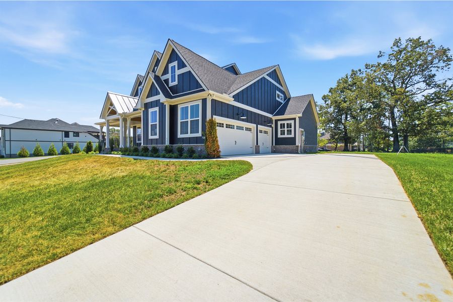 Front exterior of a new home in Belvoir, Fairview, TN, highlighting curb appeal (Image 29). Front exterior of a new home in Belvoir, Fairview, TN, highlighting curb appeal (Image 29).