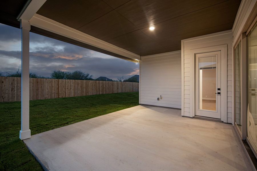 Exterior details and patio area of a home in The Reserve at Potranco Oaks, Castroville (Image 4).
