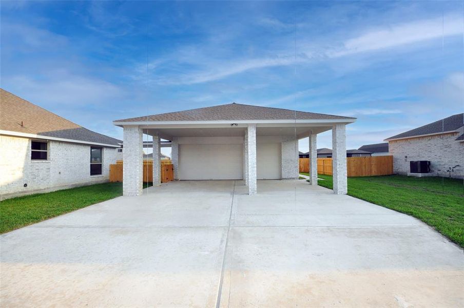 3 car Porte cochera in front of this detached garage.