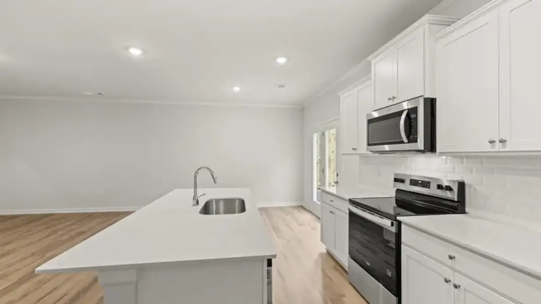 Furnished interior view inside a new home in Waypoint, Flowery Branch (Image 5).