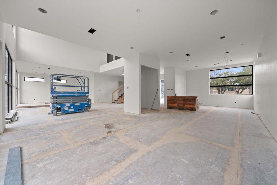 Dining room ideally positioned just off the kitchen, featuring expansive four-panel sliding doors to a balcony for seamless indoor-outdoor dining and open views across the first floor.