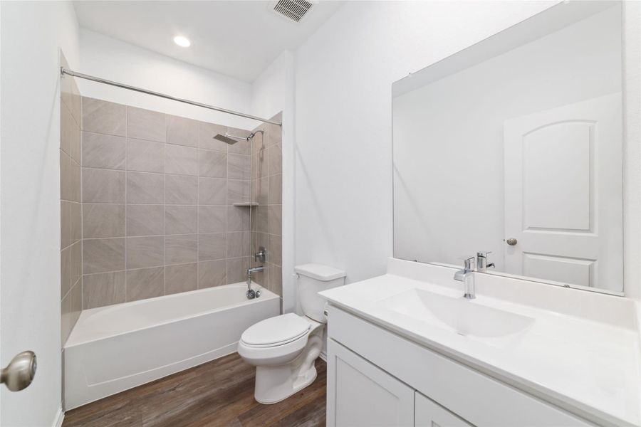 Furnished interior view inside a new home in Sunterra, Katy (Image 15).