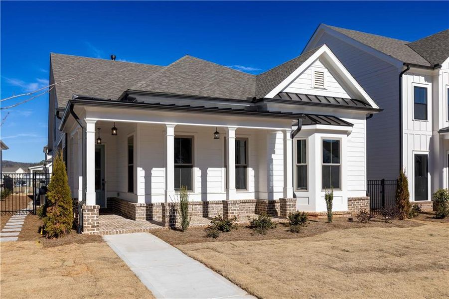 Front exterior of a new home in Promenade at Sawnee Village, Cumming, GA, highlighting curb appeal (Image 25).