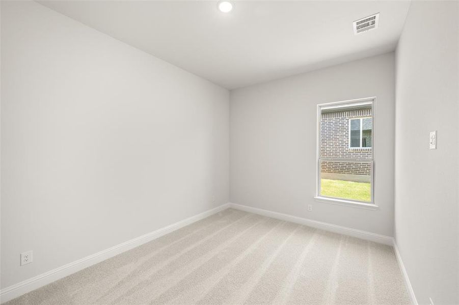 Empty room featuring light colored carpet and recessed lighting Empty room featuring light colored carpet and recessed lighting
