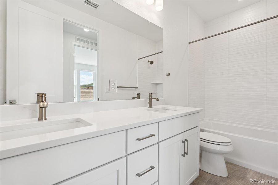 Furnished interior view inside a new home in Storytellers at Lyric, Lone Tree (Image 33).