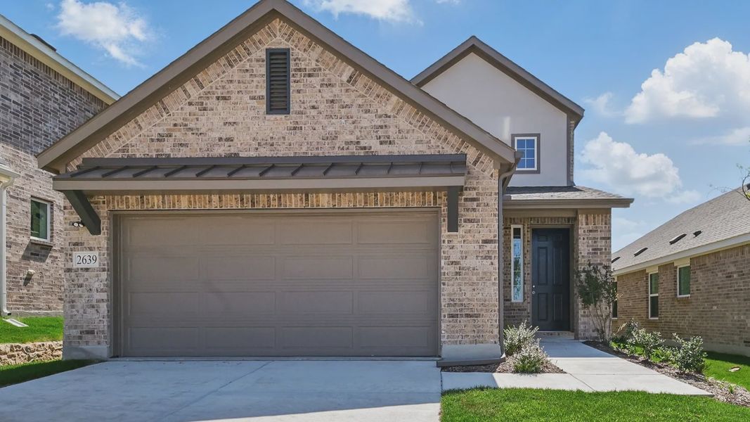 Elegant brick facade with gable roofing exudes sophistication in Latitude at Churchill. Elegant brick facade with gable roofing exudes sophistication in Latitude at Churchill.