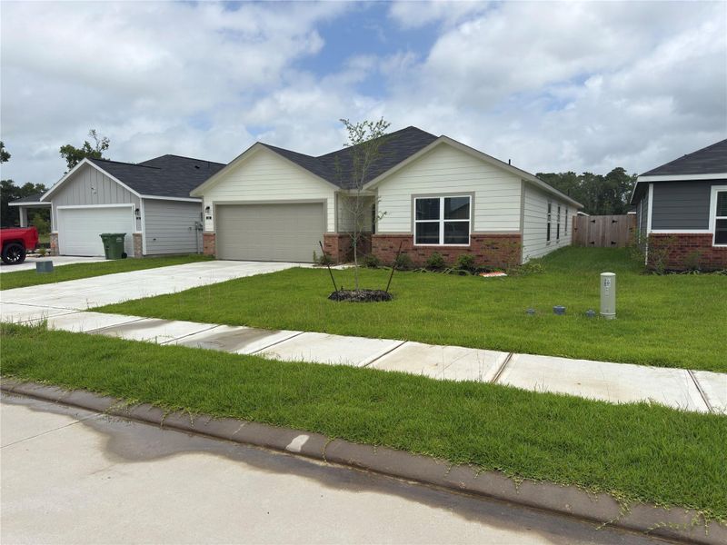 Front exterior of a new home in , Dayton, TX, highlighting curb appeal (Image 11). Front exterior of a new home in , Dayton, TX, highlighting curb appeal (Image 11).