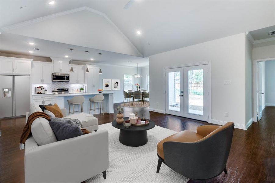 Living room featuring high vaulted ceiling, ornamental molding, sink, french doors, and dark wood-type flooring