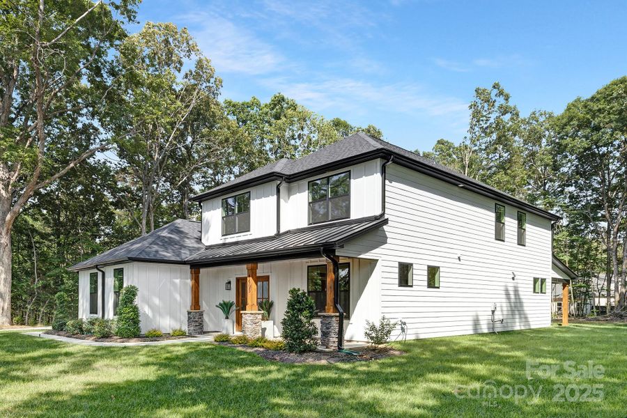 Front exterior of a new home in , Waxhaw, NC, highlighting curb appeal (Image 19). Front exterior of a new home in , Waxhaw, NC, highlighting curb appeal (Image 19).