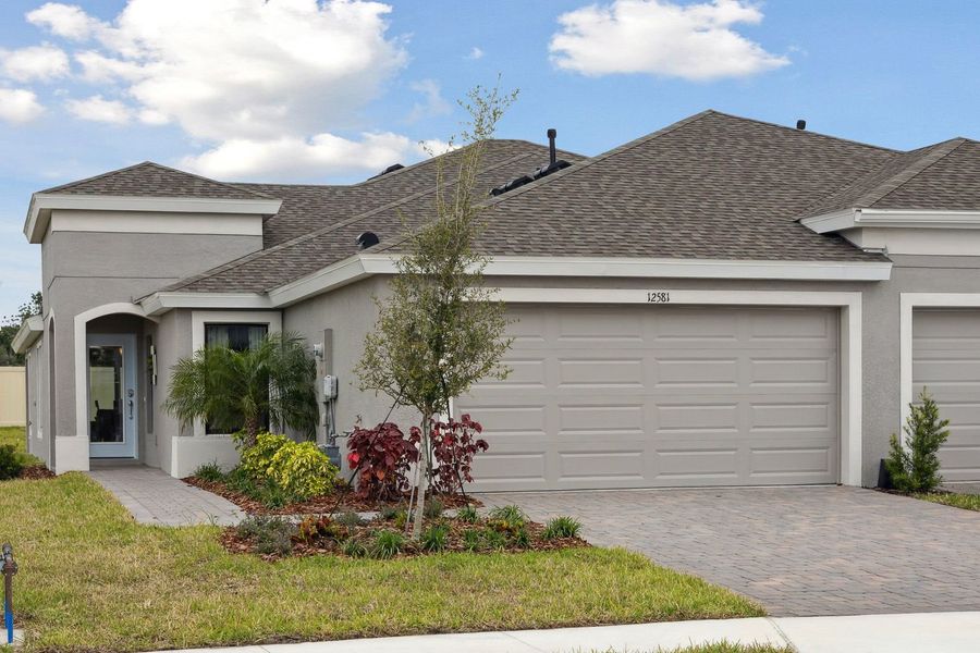 Representative exterior photo of a completed home built from the Bridgeport by Homes by WestBay in Crosswind Point, Parrish, FL (Image 15).