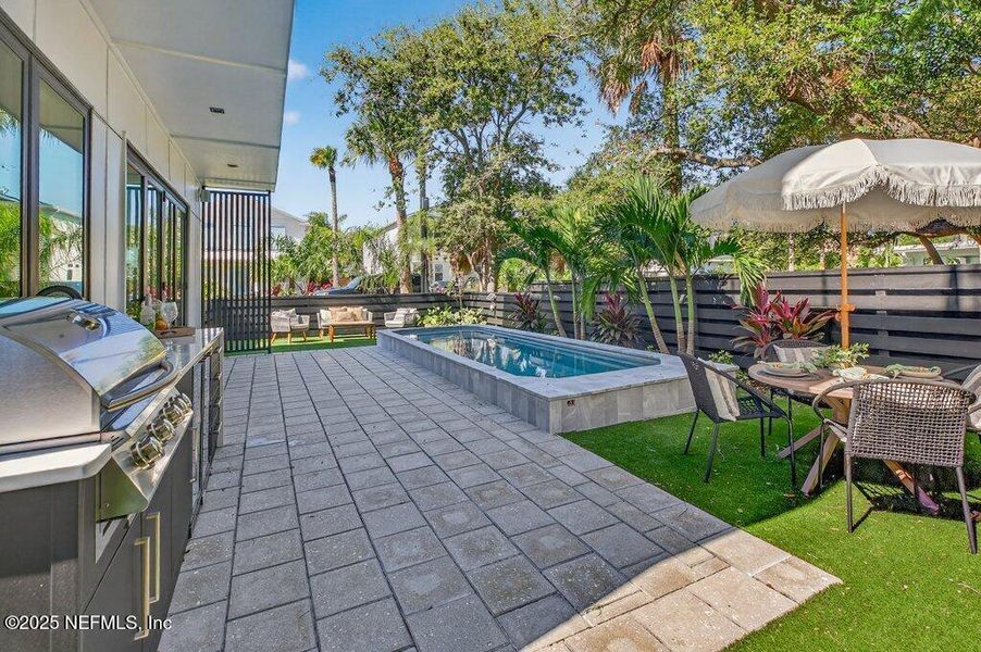 Exterior details and patio area of a home in , Neptune Beach (Image 37).