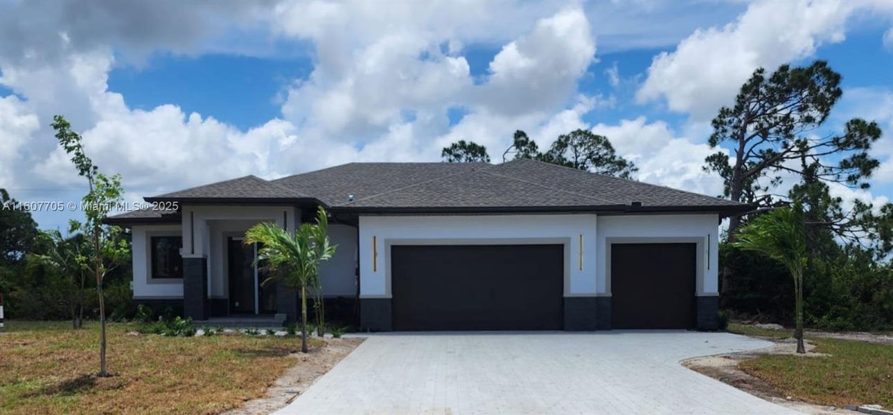 Front exterior of a new home in , Placida, FL, highlighting curb appeal (Image 9). Front exterior of a new home in , Placida, FL, highlighting curb appeal (Image 9).