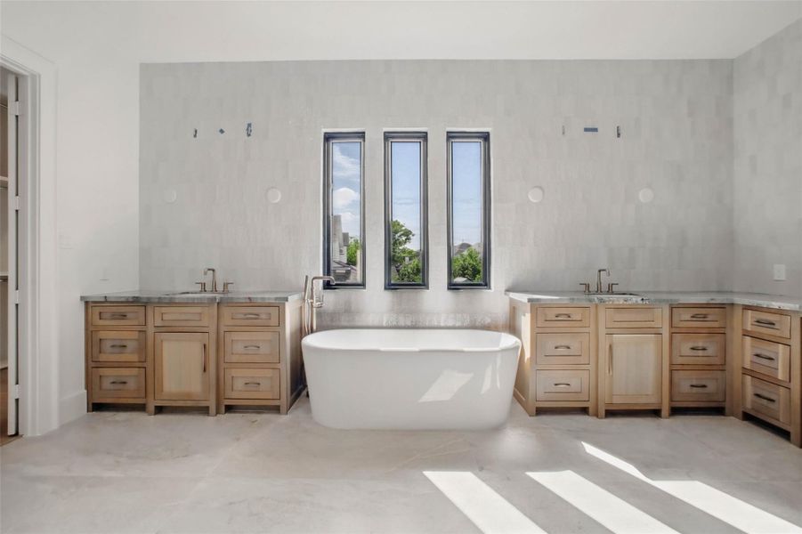 Sample of builder's previous construction. This home will have an upstairs primary suite with a massive walk-in closet, soaking tub, frameless glass shower, dual vanities. Buyer still has time to select finishes.