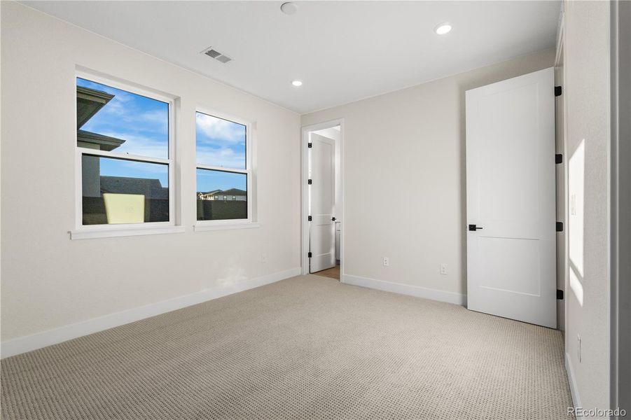 Spacious, unfurnished interior of a new home in Autograph at Lyric, Lone Tree (Image 25).