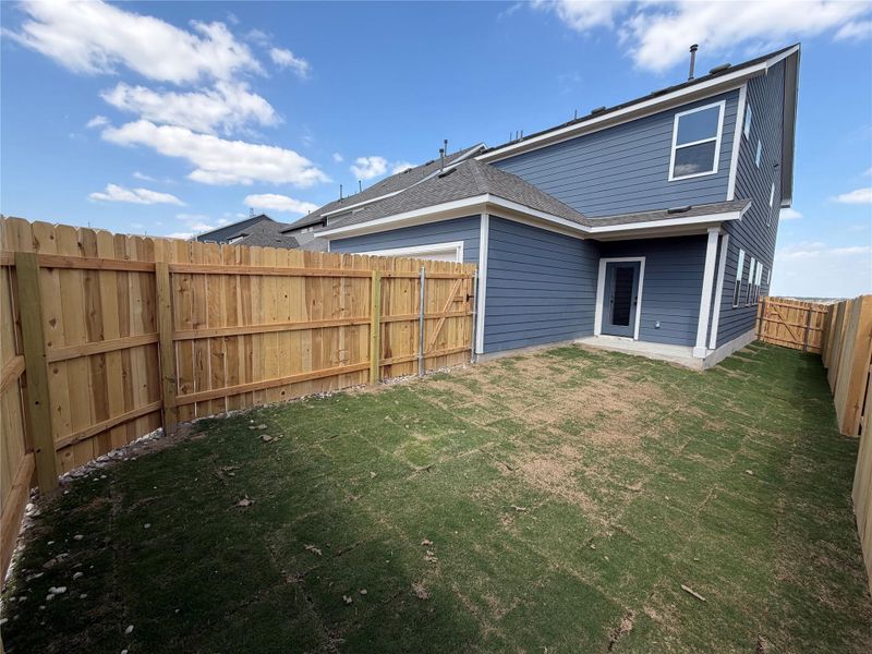 Exterior details and patio area of a home in Lariat, Liberty Hill (Image 21).