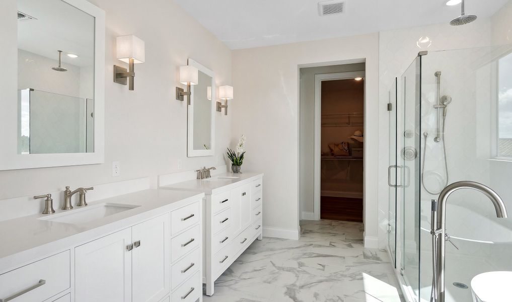 Primary bath with white marble countertop