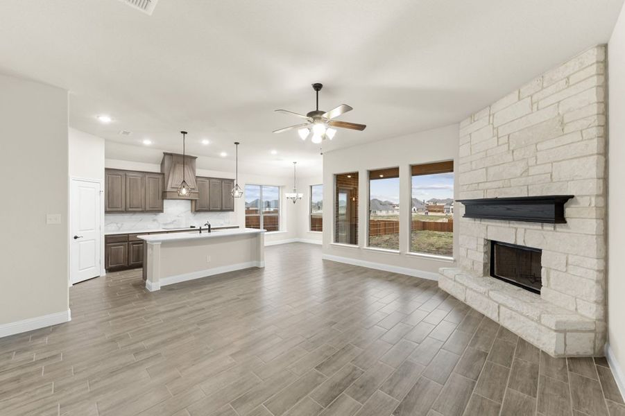 Family Room to Kitchen | Concept 2370 at Villages of Walnut Grove in Midlothian, TX by Landsea Homes