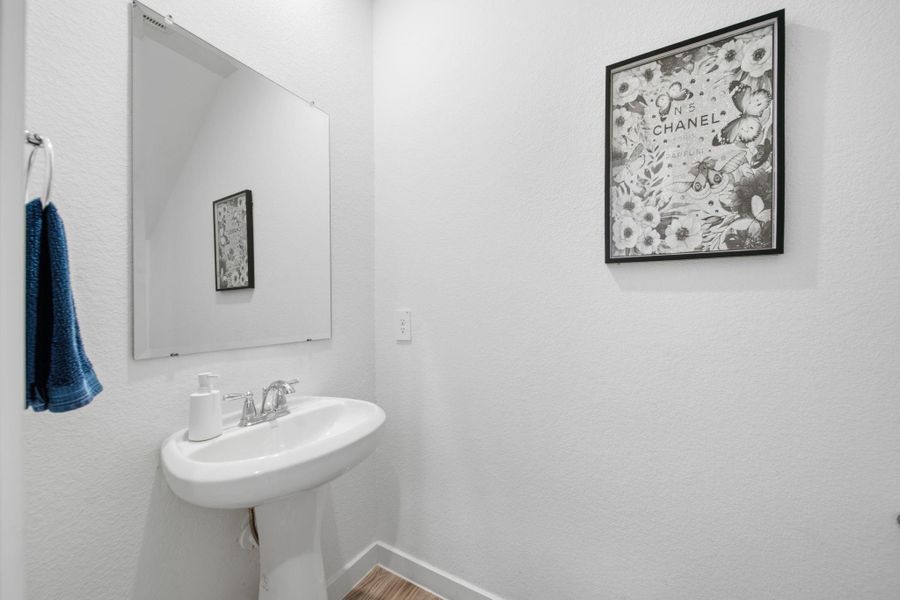 This conveniently located first-floor powder room provides easy access for guests.