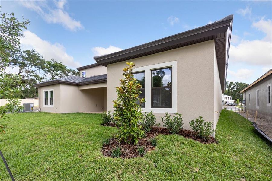 Front exterior of a new home in Crestwood Estates, Valrico, FL, highlighting curb appeal (Image 18). Front exterior of a new home in Crestwood Estates, Valrico, FL, highlighting curb appeal (Image 18).
