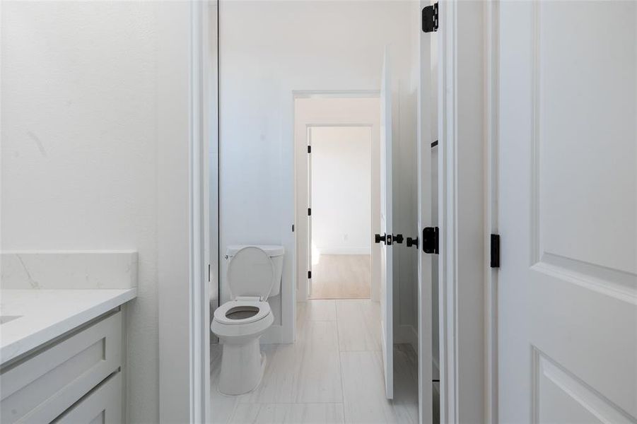 Convenient Jack-and-Jill bathroom connecting two secondary bedrooms