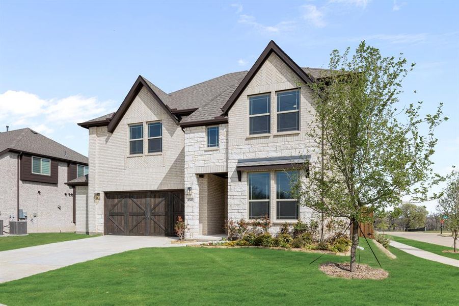 Front exterior of a new home in Windsong Ranch, Prosper, TX, highlighting curb appeal (Image 2).