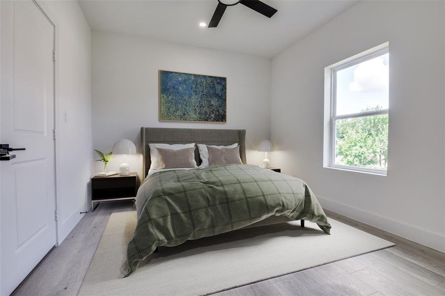 Bedroom with light wood-style floors, a ceiling fan, and recessed lighting Bedroom with light wood-style floors, a ceiling fan, and recessed lighting