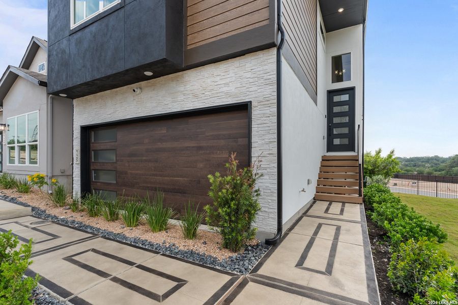 Exterior details and patio area of a home in Prominence, San Antonio (Image 22).