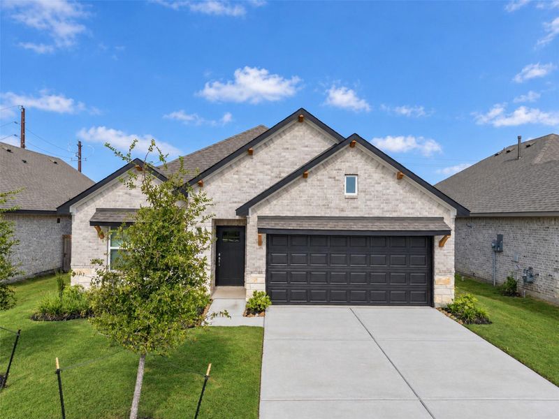 Front exterior of a new home in , Angleton, TX, highlighting curb appeal (Image 24).