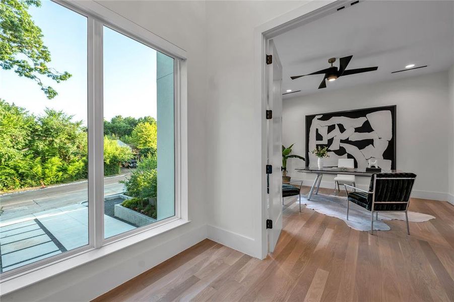 Doorway to outside with an office area, wood finished floors, recessed lighting, and a ceiling fan Doorway to outside with an office area, wood finished floors, recessed lighting, and a ceiling fan