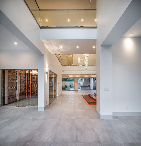 Upon entry you are immediately drawn to this amazing grand foyer with the Porcelanosa floors from Spain