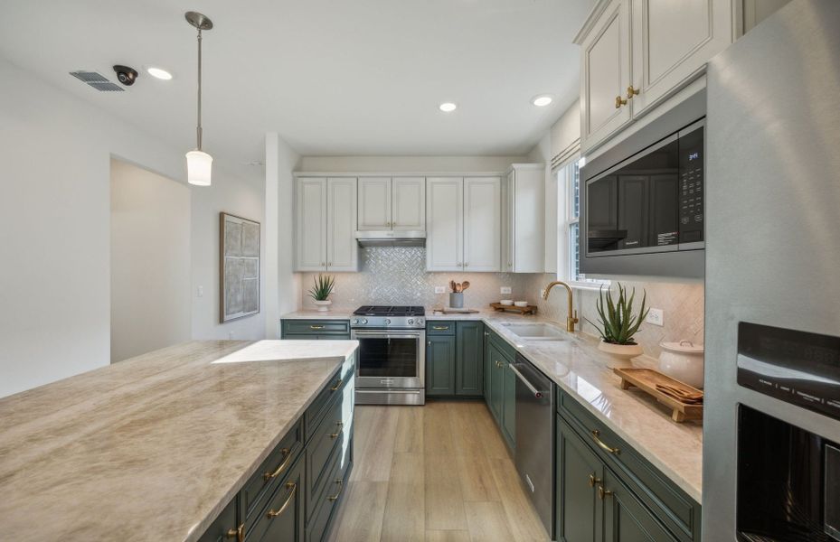 Recessed and pendant lighting in kitchen in 55+ Active Adult Floor Plan at Del Webb Barton Village Recessed and pendant lighting in kitchen in 55+ Active Adult Floor Plan at Del Webb Barton Village