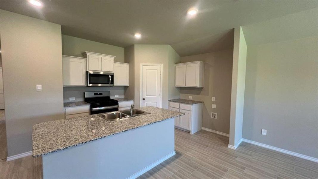 Kitchen- All Home and community information, including pricing, included features, terms, availability and amenities, are subject to change at any time without notice or obligation. All Drawings, pictures, photographs, video, square footages, floor plans, elevations, features, colors and sizes are approximate for illustration purposes only and will vary from the homes as built.