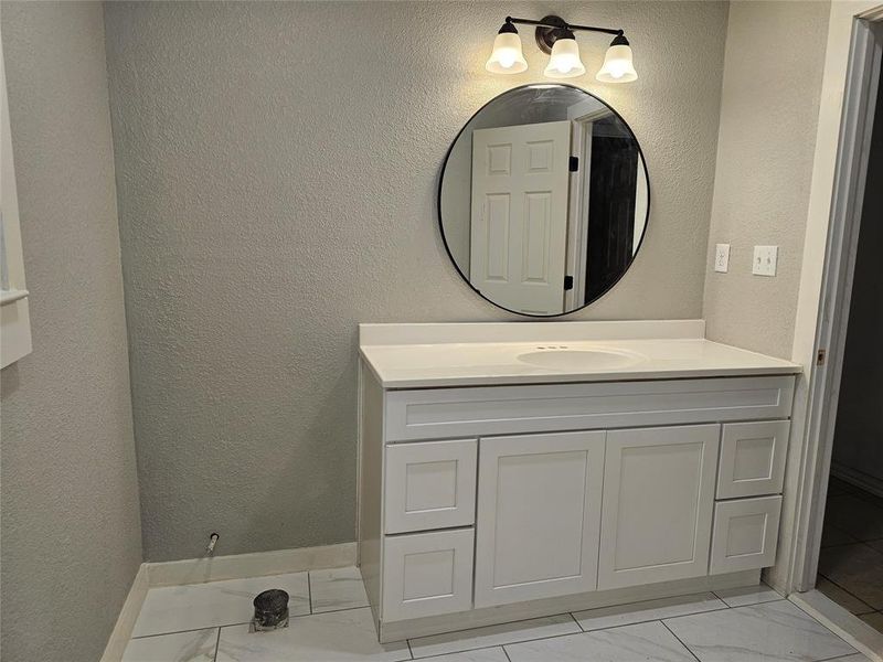 Bathroom featuring vanity Bathroom featuring vanity