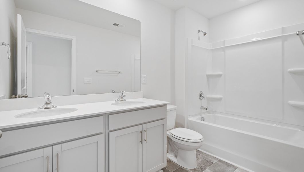 Representative furnished interior of a home built from the AISLE by D.R. Horton in Harrier Point, Woodruff (Image 10).