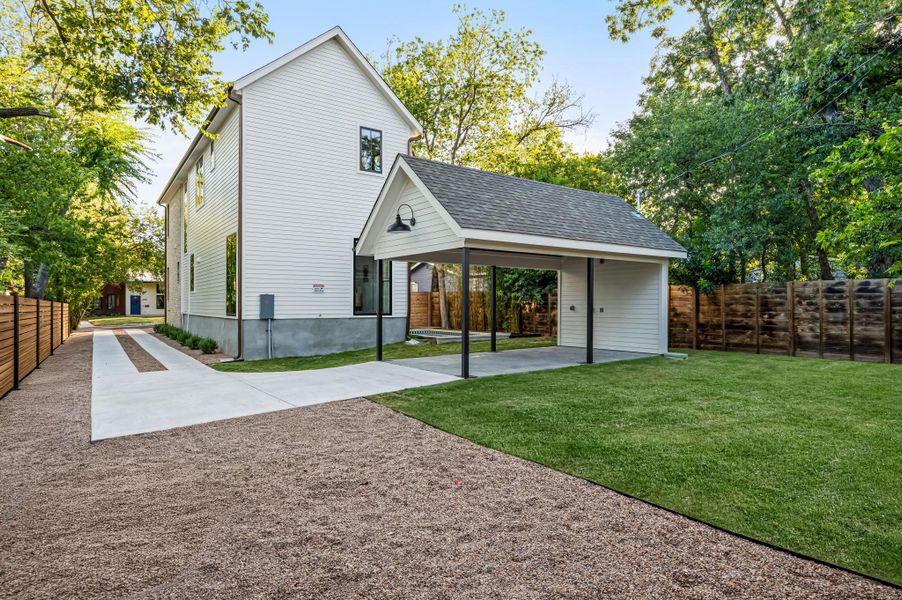 A well-maintained lawn and extended driveway enhance the property's exterior, offering ample space and curb appeal.