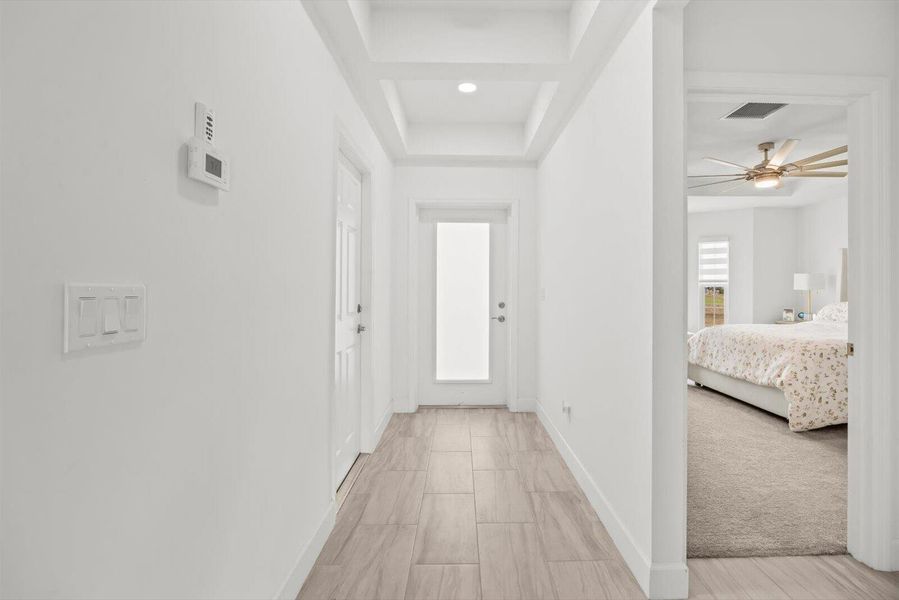 Bright and Airy Entryway Featuring Modern Tray Ceiling Details