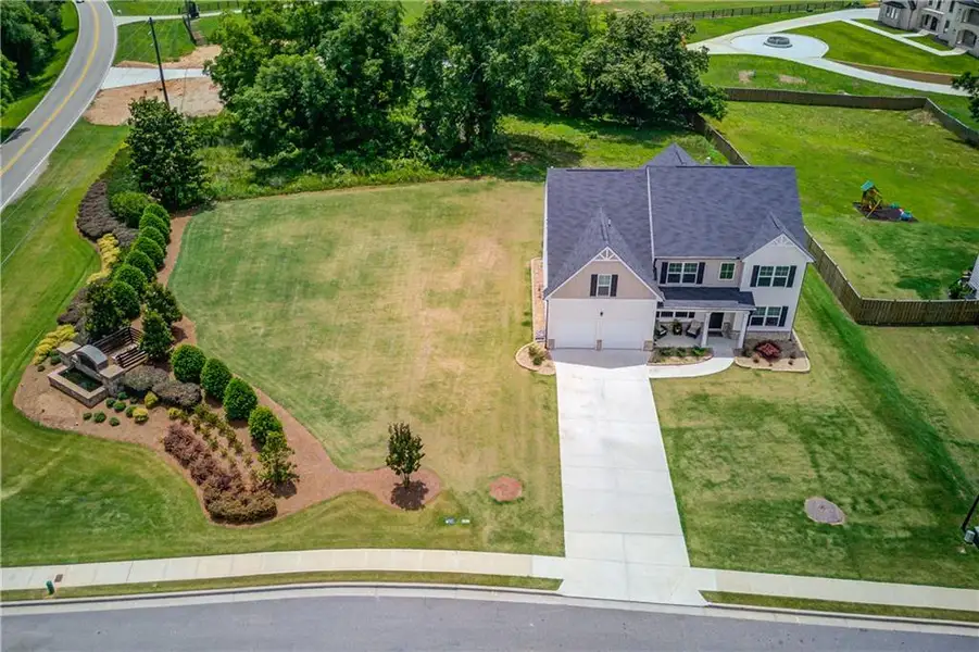 Front exterior of a new home in Stillwater Springs, Dacula, GA, highlighting curb appeal (Image 1). Front exterior of a new home in Stillwater Springs, Dacula, GA, highlighting curb appeal (Image 1).