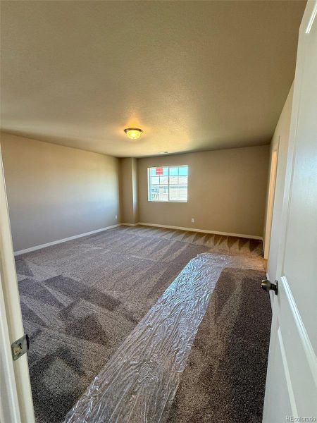 Spacious, unfurnished interior of a new home in Sky Ranch - Highland Collection, Watkins (Image 11).